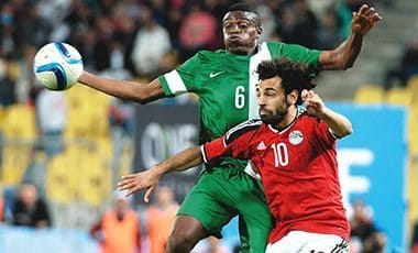 Egypt’s Mohamed Salah (right) and Nigeria’s Stanley Amuzie during their African Cup of Nations qualification match played at the Borg el-Arab Stadium in Alexandria...on Tuesday. Photo: AFP