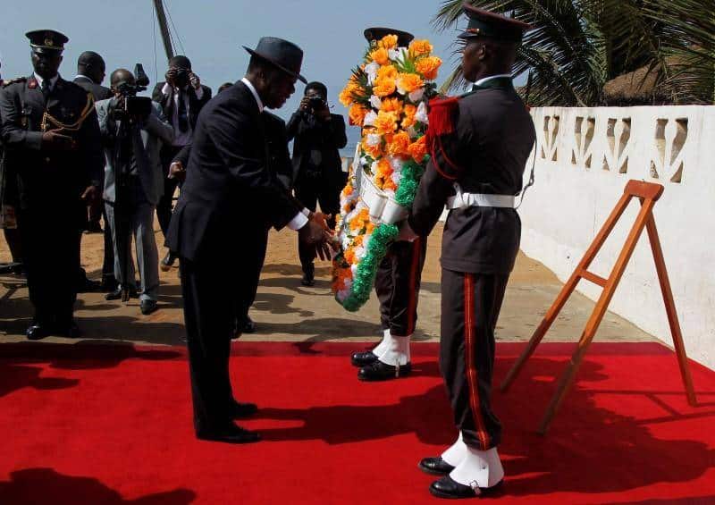 Ivory Coast's President Alassane Ouattara prepares to lay a wreath for those killed in Sunday's attack by Al Qaeda in the Islamic Maghreb, on a beach in Grand Bassam.