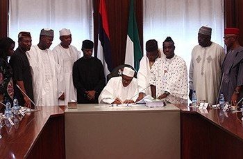 Nigerian President, Muhammodu Buhari signing the 2016 Budget