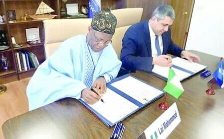 Lai Mohammed and the UNWTO’s Secretary-General signing agreement for African Tourism meeting
