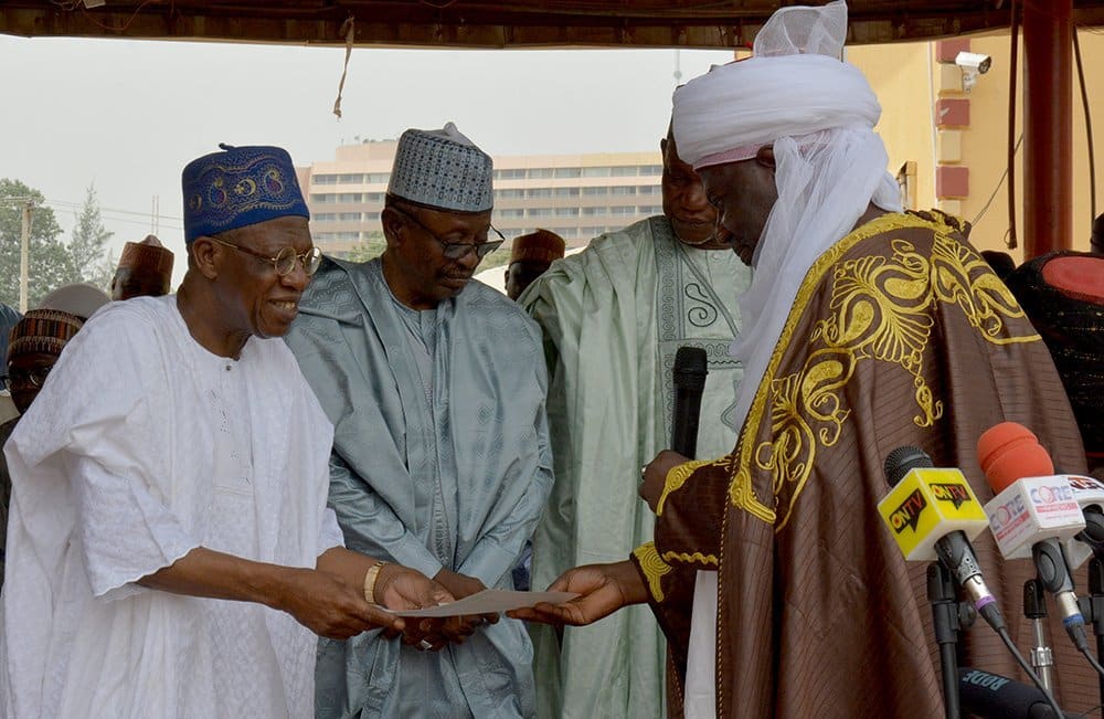 Lai Mohammed receiving certificate as the Kakaki Kebbi from the Emir of Argungu