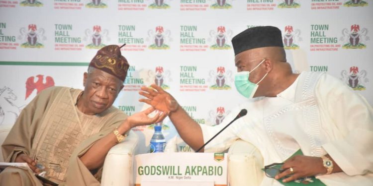 Minister, Niger Delta Affairs, Senator Godswill Akpabio, (r) with the Minister, Information and Culture Ministry, Alhaji Lai Mohammed, at the Town Hall meeting on Destruction of Oil and Gas Infrastructure, in Abuja on Monday.