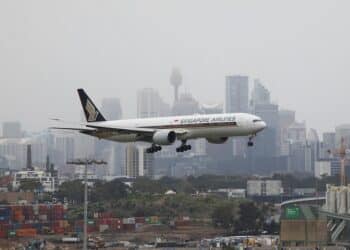 A Singapore Airlines plane arriving from Singapore lands at the international terminal at Sydney Airport, as countries react to the new coronavirus Omicron variant amid the coronavirus disease (COVID-19) pandemic, in Sydney, Australia.