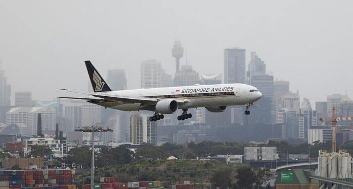 A Singapore Airlines plane arriving from Singapore lands at the international terminal at Sydney Airport, as countries react to the new coronavirus Omicron variant amid the coronavirus disease (COVID-19) pandemic, in Sydney, Australia.