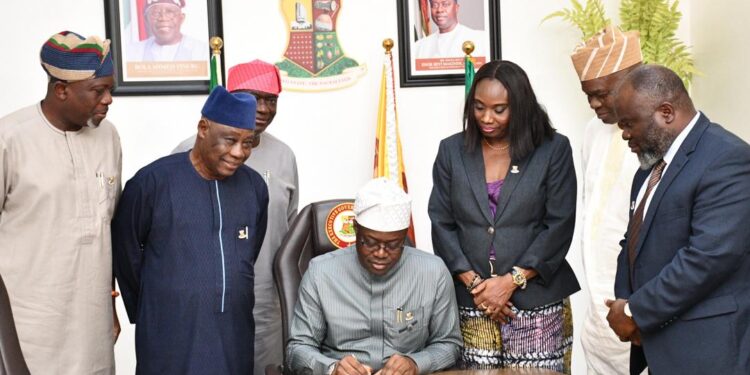 Oyo State Governor, Seyi Makinde (middle), signing the Executive Order on the Protection of Mining Communities against Insecurity and Exploitation in the State and the Executive Order on the Establishment of the Ministry of Culture and Tourism. With him from left are the Chief of Staff, Hon Segun Ogunwuyi (left); Deputy Governor, Barr Bayo Lawal; Chairman, Oyo State Minerals Development Agency, Hon Abiodun Oni; Secretary to the State Government, Prof Olanike Adeyemo; Commissioner for Culture and Tourism, Dr Wasiu Olatunbosun and the Attorney General and Commissioner for Justice, Barr Abiodun Aikomo, at the Governor's Office, Secretariat, Ibadan. PHOTO: Oyo Gov's Media Unit.
