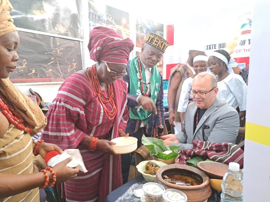 Canadian Diplomats eating Ekiti Cuisine pounded yam
