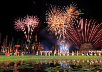 Traditional Thai in Loy Krathong festival showing in Wat Mahathat Sukhothai historical park Thailand New Year